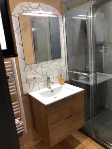 a bathroom with a sink and a shower at Riviera Cottage in Comblain-au-Pont