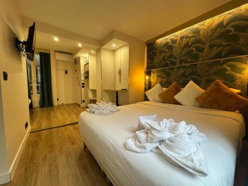 Postelja oz. postelje v sobi nastanitve Hotel Nation Montmartre