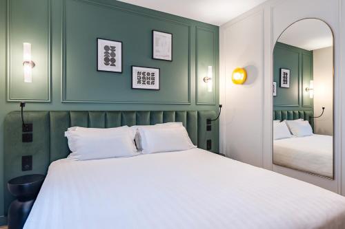 Ένα ή περισσότερα κρεβάτια σε δωμάτιο στο Hotel Elysée Secret