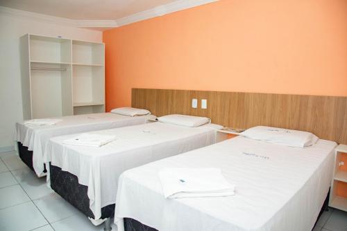 Ένα ή περισσότερα κρεβάτια σε δωμάτιο στο Trip Hotel Lauro de Freitas