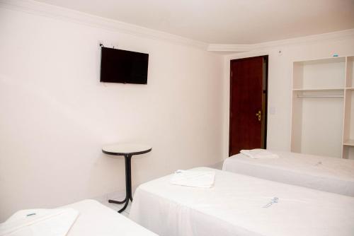 Ένα ή περισσότερα κρεβάτια σε δωμάτιο στο Trip Hotel Lauro de Freitas