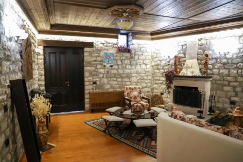 a living room with a couch and a table at Villa Oda Tomori in Berat