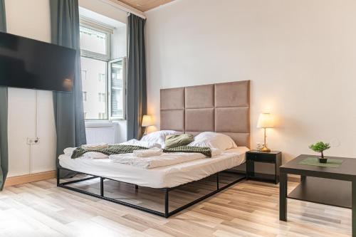 a bedroom with a large bed in a room at Neighboring 3 Apts.- Ideal for Families & Friends in Vienna