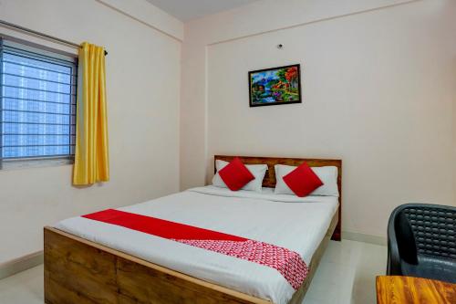 Postel nebo postele na pokoji v ubytování Hotel O VBH Inn