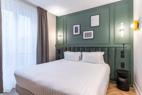 Ένα ή περισσότερα κρεβάτια σε δωμάτιο στο Hotel Elysée Secret