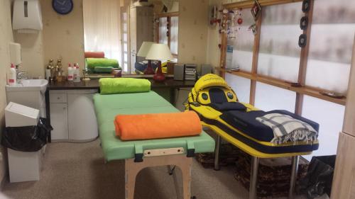 a room with a kitchen with a sink and a rescueseat at To Tu in Mrągowo