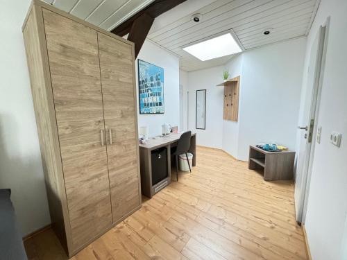 an office with a large wooden door in a room at Pension Sonnenschein in Halle an der Saale