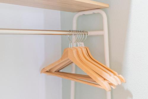 a wooden hanger is hanging on a wall at B&B La Volpe in Moneglia