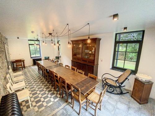 a dining room with a large wooden table and chairs at Gîte à Esneux - A La Belle Epoque d'Esneux in Esneux