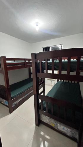 Postel nebo postele na pokoji v ubytování Adonai Campos dos Goytacazes parque rodoviário