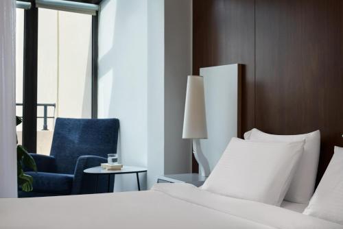 Postel nebo postele na pokoji v ubytování Lato Boutique Hotel