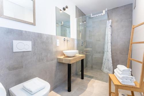 a bathroom with a sink and a shower at Boardinghouse in Bad Reichenhall