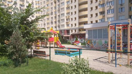 a park with a playground and a play area at FlatService Двокімнатні апартаменти в ЖК "4 сезони" in Kyiv