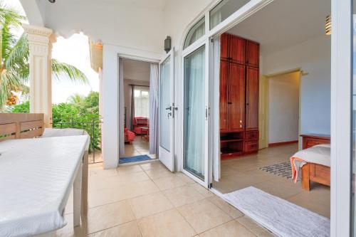 a bedroom with a bed and a door to a room at Flo Villa in La Gaulette