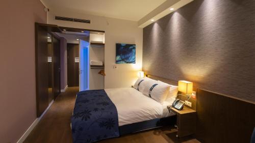 Ένα ή περισσότερα κρεβάτια σε δωμάτιο στο FEZ INN Hotel