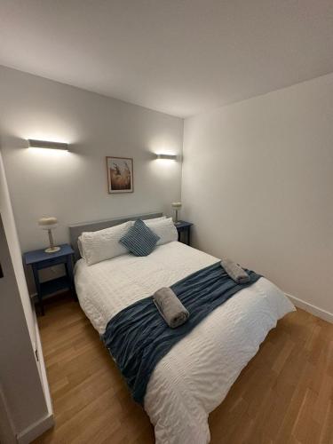 a bedroom with a bed with two pillows on it at Seven Space 2 Bed 2 Bath Central Apartment in Norwich