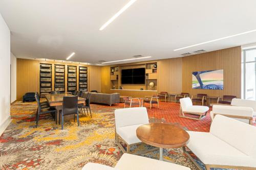 a conference room with white chairs and a table at Chicago Marriott Naperville in Naperville