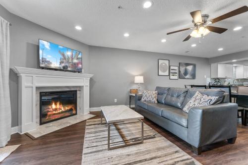 a living room with a couch and a fireplace at FREE Silver Dollar City & other ATTRACTION TICKETS! Spacious, Great location, Indoor & Outdoor pools in Branson