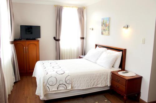 Hotel La Casonaにあるベッド