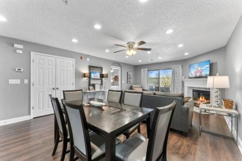 a dining room and living room with a table and chairs at FREE Silver Dollar City & other ATTRACTION TICKETS! Spacious, Great location, Indoor & Outdoor pools in Branson