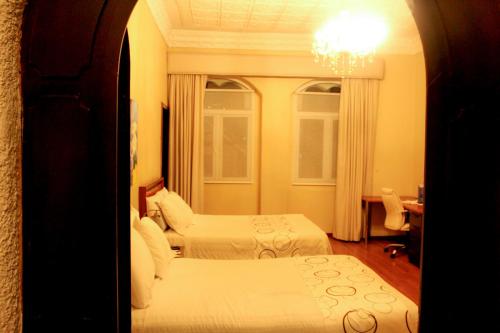 Hotel La Casonaにあるベッド