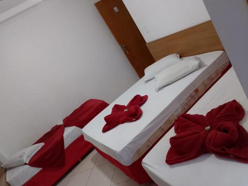 Uma cama ou camas num quarto em Hotel São Luiz