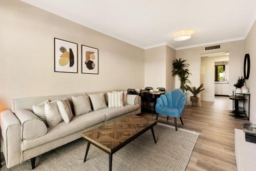 a living room with a couch and a table at Royal Marbella Golf Resort in Estepona
