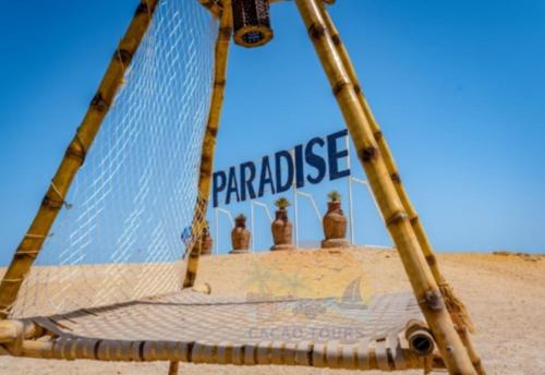 a volleyball net in the middle of a beach at Paradise island in Hurghada