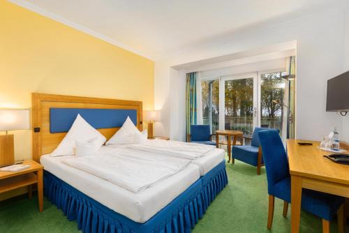 Katil atau katil-katil dalam bilik di IFA Graal-Müritz Hotel & Spa