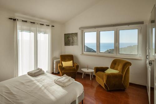 Ένα ή περισσότερα κρεβάτια σε δωμάτιο στο Casa do Magoito