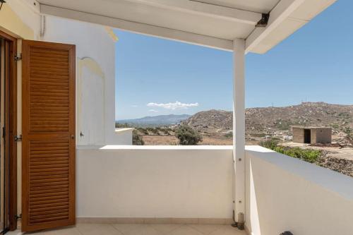 a balcony with a view of the mountains at Gavriella House in Mélanes