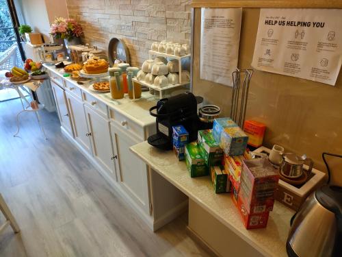 a kitchen with a counter with food on it at Domus Mariae B&B Assisi in Assisi