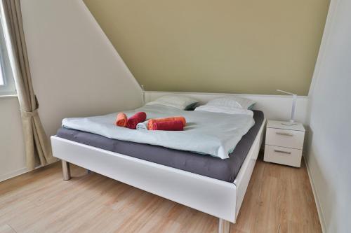 Postel nebo postele na pokoji v ubytování InselReiter - Ferienwohnung WindReiter