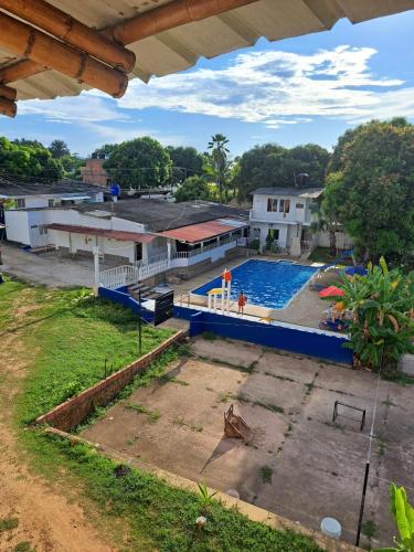 an overhead view of a large swimming pool at Hotel santa marta Melgar in Melgar