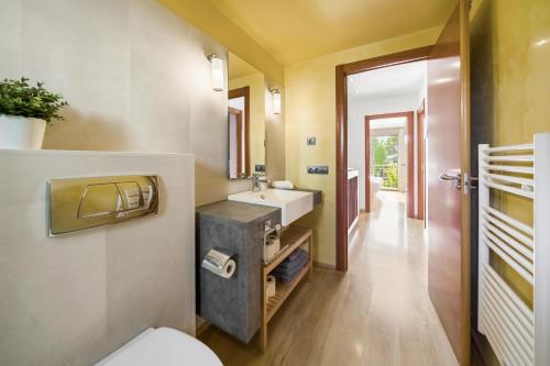 a bathroom with a sink and a toilet at Duplex Can Volanti in Port de Pollensa