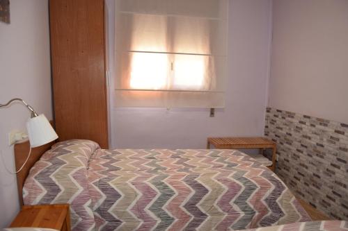 En eller flere senge i et værelse på Casa Rural Natalia