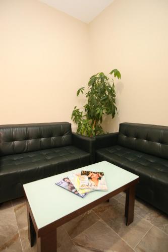 a living room with a couch and a coffee table at Blue Bay Residence in Vlorë