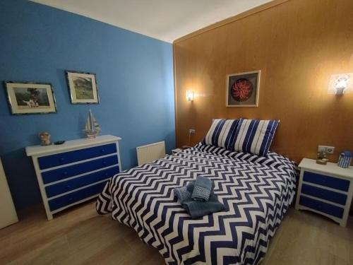 מיטה או מיטות בחדר ב-Casa Platja d'en Robert