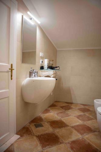 a bathroom with a sink and a toilet at Pocco Andante in Dubrovnik