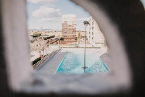 Vista de la piscina de Apartamento pobla farnals playa o alrededores