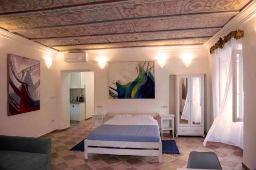 a bedroom with a large bed in a room at Andante con nobile in Dubrovnik