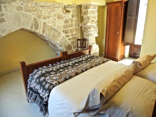 A bed or beds in a room at B&B Sei Stelle