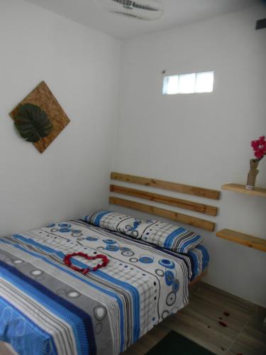 Una cama o camas en una habitación de HostalNativo
