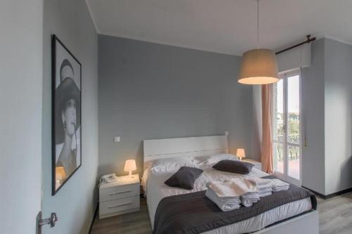 Säng eller sängar i ett rum på Al Borgo Apartments