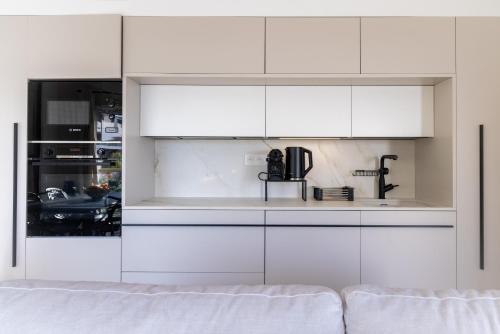 Η κουζίνα ή μικρή κουζίνα στο SPLENDIDE APPARTEMENT NICE BLUE PEARL TOUT CONFORT VUE MER PANORAMIQUE