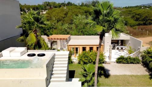 an aerial view of a house with a swimming pool at Casa SANA in Puerto Escondido