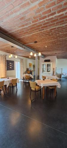 a large room with tables and chairs in it at B&B Euverbraeke in Beveren