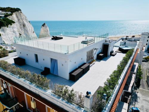 a house with a view of the ocean at V Penthouse in Vieste
