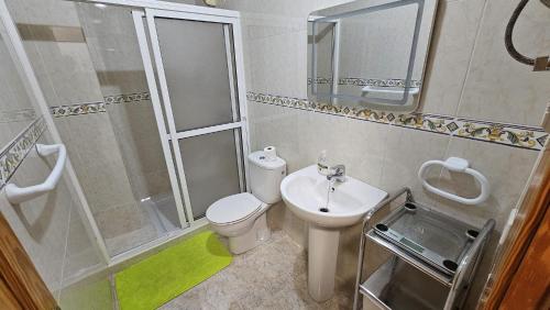 a bathroom with a shower and a toilet and a sink at Escapada al Sur in Morro del Jable