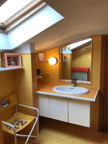 a bathroom with a sink and a mirror at Monolocale A Modo Mio B&B in Bologna